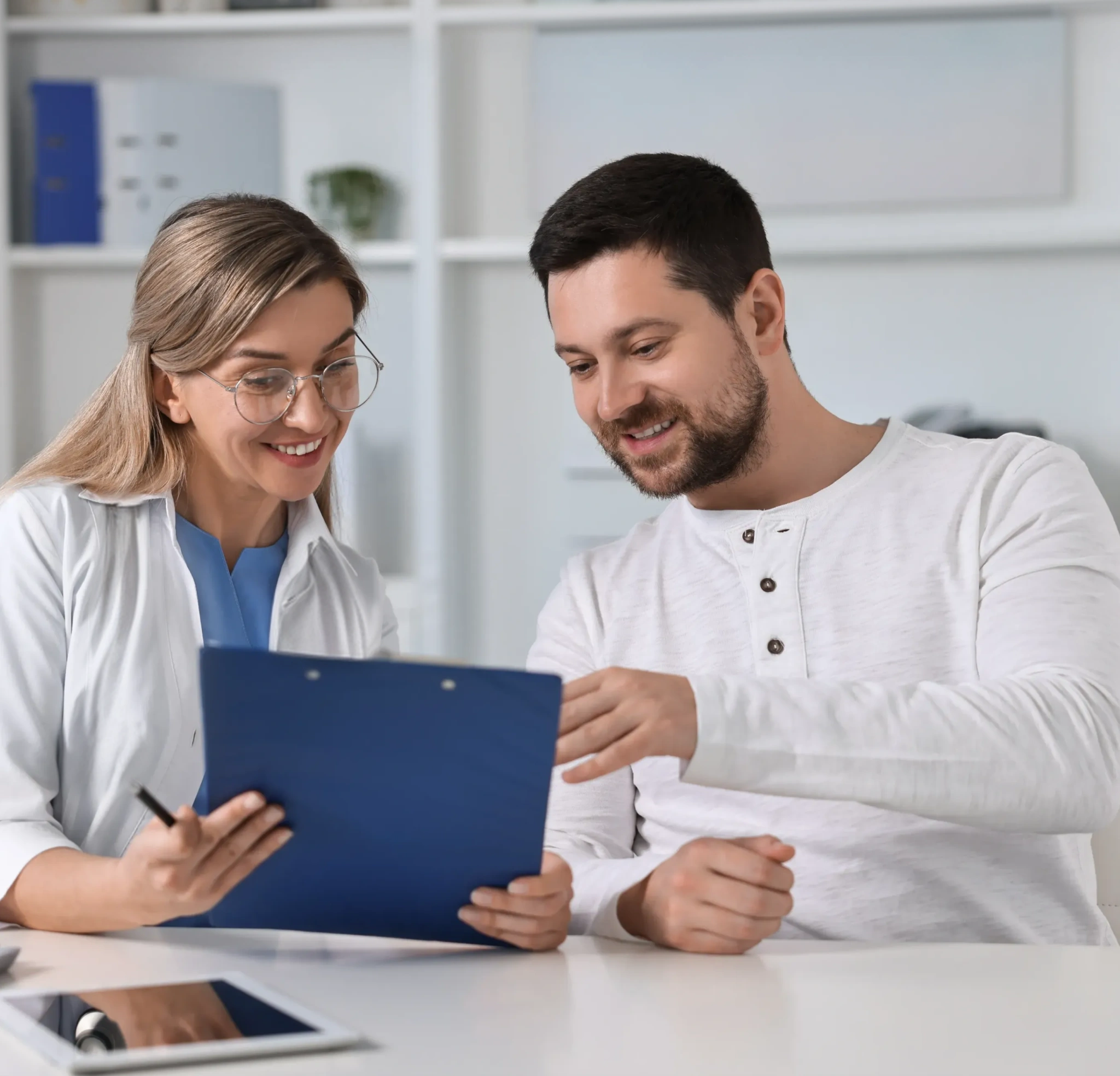 Doctor reviewing paperwork with a patient